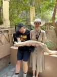 May be an image of 2 people and snake