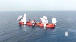 May be an image of submarine and ocean