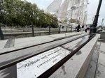 May be an image of 7 people, monument and text
