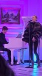 May be an image of 3 people and piano