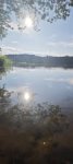 May be an image of lake and twilight